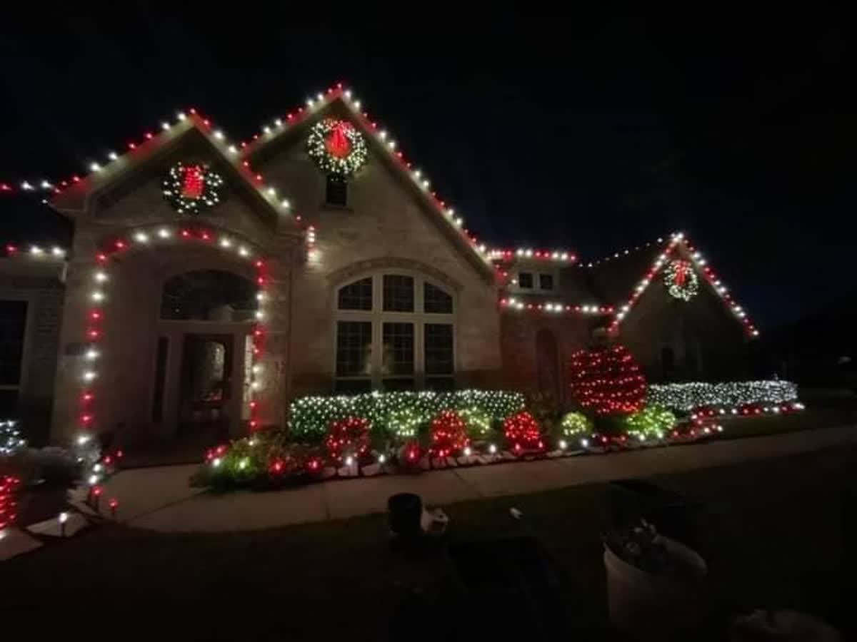 Landscape and pathway lighting leading up to a lit home